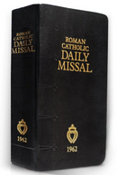1962 Roman Catholic Daily Missal with a black leather cover, gold embossed text, and an emblem on the spine and front cover.